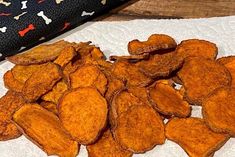 a pile of potato chips sitting on top of a white towel