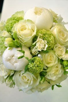 a bridal bouquet with white roses and green foliage