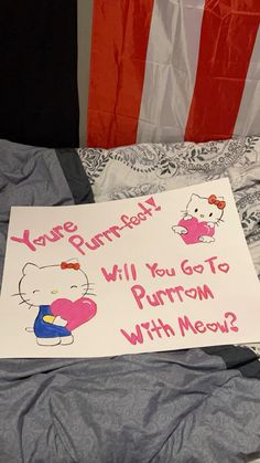 a hello kitty birthday sign on a bed with an american flag in the background that says, you're burned will you go to purton with meow?