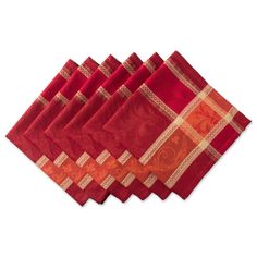 six red napkins with gold designs on them