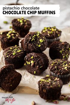 chocolate chip muffins with pistachio sprinkles on parchment paper