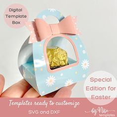 a hand holding an origami box with a gold piece in it and the words special edition for easter written below