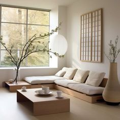 a living room filled with furniture and a large window