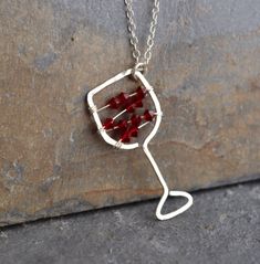 I'll have a glass of your finest red! Maybe you love the less-serious side of jewelry. Maybe you just love wine! I know I do. This hand-hammered necklace is sure to bring smiles and conversation wherever you go. Tiny Swarovski crystal beads strung on sterling silver wire stand in for your favorite red. The pendant is approximately 0.5 inches wide and approximately 1.25 inches long. Choose your chain length, or leave a note to seller if you would like a chain length other than those listed. All i Sterling Silver Jewelry For Mother's Day Party, Wire Wrapped Jewelry For Valentine's Day Anniversary, Valentine's Day Wire Wrapped Jewelry For Anniversary, Mother's Day Party Sterling Silver Necklace, Gift Wrapped Silver Jewelry For Birthday, Silver Necklaces For Mother's Day Party, Silver Jewelry Gift Wrapped For Gift, Silver Jewelry Gift Wrapped For Mother's Day, Gift Wrapped Silver Jewelry