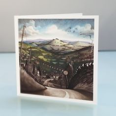 a greeting card with an image of a landscape