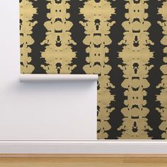 a black and gold wallpaper with an ornate design on it's sidewall