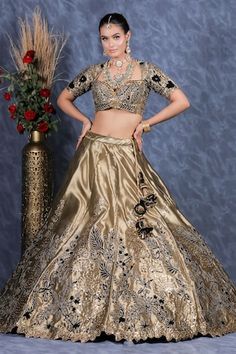 Olive green flared tissue organza kalidar lehenga with contrasting black velvet patch ambrosia embroidery and gota lace bloom highlights. Paired with a matching embroidered flattering Queen Anne neck blouse and a spluttered mukaish embellished cutwork bloom border organza dupatta. - Aza Fashions Fitted Gold Organza Traditional Wear, Gold Fitted Organza Traditional Wear, Fitted Anarkali Blouse Piece In Organza, Fitted Anarkali Organza Blouse Piece, Fitted Organza Anarkali Blouse Piece, Gold Organza Fitted Blouse Piece, Gold Organza Blouse Piece For Reception, Transitional Party Choli In Organza, Fitted Organza Blouse Piece For Reception