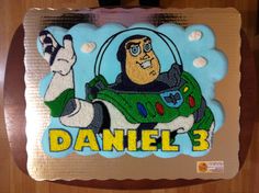 a cake that is shaped like a cartoon character with the name daniel 3 on it