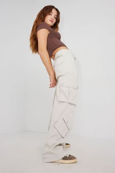 Who needs a bag? Features - Zip fly with button closure - Cargo pockets with button closure Size & Fit - Fit: Relaxed - Rise: 10.5" - Inseam: 33" - Model is wearing size S Materials & Care - Content: 98% cotton, 2% spandex - Care: Wash cold, inside out - Imported Girls Cargo Pants, White Cargo Pants, Garage Clothing, Cargo Pants Women, Cargo Pant, Cargo Jeans, Pantalon Cargo, Bottom Clothes, Pull On Pants