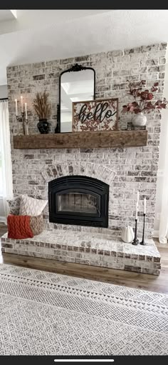 a living room with a brick fireplace and white rug