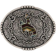 There is nothing like a Western sunrise and this Sunrise Bronc Attitude Buckle captures a fraction of its beauty. The antiqued silver tone buckle contains both etched and raised filigree creating a dynamic backdrop for the silhouette of a rider upon a bucking bronco. A Southwestern pattern filled with tones of red, yellow, orange and green fills the silhouette figure. This buckle is perfect for any occasion with a pop of subtle color. Standard 1.5 inch swivel. Montana Silversmiths Attitude Buckl Adjustable Silver Southwestern Belt Buckles, Adjustable Engraved Silver Belt Buckles, Artisan Silver Adjustable Belt Buckles, Artisan Adjustable Silver Belt Buckles, Silver Bohemian Adjustable Belt Buckles, Southwestern Silver Belt Buckle With Antique Detail, Artisan Silver Belt Buckle With Antique Detail, Silver Artisan Belt Buckle With Antique Design, Western Sunrise