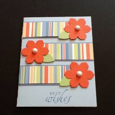 a card with three flowers on it