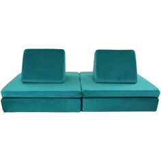 a pair of teal colored couches with matching cushions