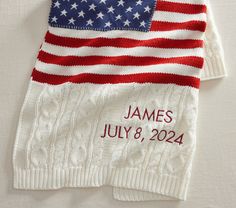 an american flag knitted sweater with the name james and date written in red, white, and blue