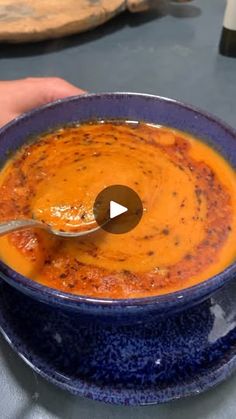 a bowl of soup with a spoon in it