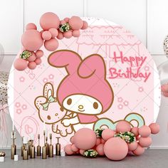 a hello kitty birthday party with balloons and decorations