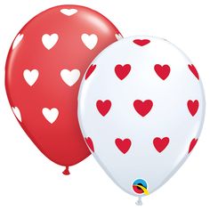 two red and white balloons with hearts on them