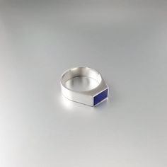 Beautiful modern ring with Lapis Lazuli and Sterling silver. Unique gift for her or him, girlfriend, wife, mom, friend, September and December birthstone, 8 year anniversary. The natural blue Lapis Lazuli stone is cut to a rectangle shape and set in Sterling silver. This beautiful ring is worked with the technique of inlay, which means the stone is worked seamlessly into the Sterling silver. All our inlay work is real stone, not ceramic stone dust. All our stones are natural stones and our jewel Modern Stainless Steel Jewelry For Anniversary, Modern Stainless Steel Signet Ring For Anniversary, Fine Jewelry Sterling Silver Signet Ring Gift, Modern Gemstone Signet Ring For Promise, Modern Signet Ring With Gemstone For Promise, Modern Gemstone Signet Promise Ring, Modern White Gold Rings For Gift, Modern White Gold Rings For Gifts, Blue Polished Signet Ring As Gift