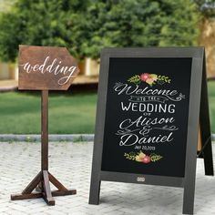 a sign that is sitting on the ground next to another sign with a wedding message