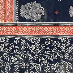 an intricately designed blue and red cloth