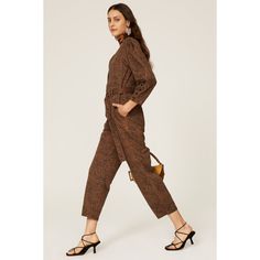 Multicolor animal print cotton (100% cotton). Jumpsuits. V-neck. Long sleeve. Front button closure. 57" from shoulder to hemline. Imported. Printed Long Sleeve Jumpsuit For Fall, Printed Long Sleeve Jumpsuits And Rompers For Fall, Spring Leopard Print Jumpsuits And Rompers, Chic Cotton Jumpsuits And Rompers For Fall, Chic Long Sleeve Cotton Jumpsuits And Rompers, Chic Long Sleeve Cotton Jumpsuit, Relaxed Fit Brown Jumpsuits And Rompers For Fall, Printed Jumpsuits And Rompers For Fall, Brown Cotton Jumpsuits And Rompers For Work