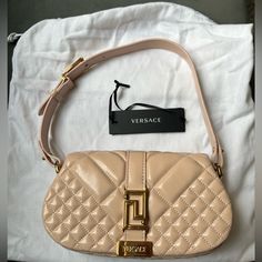 Versace Unused Pink Mini Bag. Looks Slightly Pinker Than Shown In Photos. Hasn't Been Taken Out Of Bag Since Purchasing. Bought For $1650 Asking $1100. Dm For More Photos If Needed Designer Beige Baguette Bag With Gold-tone Hardware, Luxury Baguette Bag With Branded Hardware For Shopping, Designer Baguette Bag With Branded Hardware, Luxury Beige Baguette Bag For Evening, Designer Beige Baguette Bag In Pouch Shape, Designer Clutch Baguette Bag With Gold-tone Hardware, Luxury Beige Baguette Bag For Shopping, Luxury Baguette Bag For Shopping, Designer Beige Baguette Bag For Formal Occasions