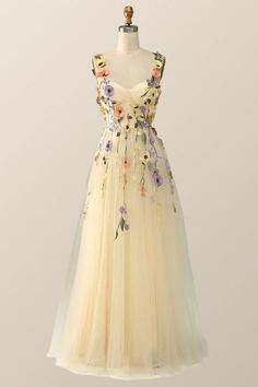 a dress on a mannequin with flowers