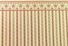 a red and white striped wallpaper with an ornate design on the top, along with other decorative elements