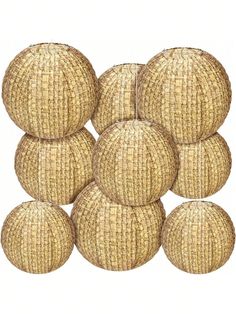 six round wicker balls stacked on top of each other in front of a white background