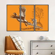 an orange room with two birds flying in the sky