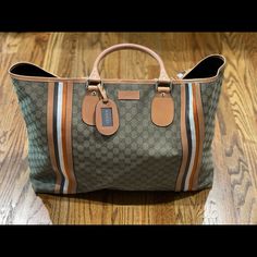 Serious Shoppers Only. Gorgeous And Never Carried Gucci Overnight Travel Bag. Can Be Used As A Large Beach Bag Or Large Travel Tote. This Is From My Personal Collection And I’ve Never Used It So It Is Brand New. No Flaws. Comes From A Non Smoking Home With No Pets/Pests. Comes With Original Cards And Dust Bag. Measures 16*24*5 (Approximately) This Is 100% Authentic. Inside Has A Zipper Pocket. Bag Closes With Clasp Hardware, See Pics. Hardware Is Gold. This Bag Holds A Lot. It’s Big!!! Truly A C Designer Rectangular Travel Bag For Shopping, Designer Travel Bag For Shopping, Designer Rectangular Travel Bag With Leather Handles, Designer Travel Bag With Leather Handles For Shopping, Designer Rectangular Travel Bag, Designer Coated Canvas Tote Travel Bag, Designer Rectangular Coated Canvas Travel Bag, Luxury Shopping Tote Travel Bag, Designer Tote Travel Bag