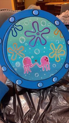 a paper plate with an octopus and jellyfish design on it