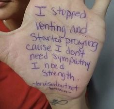 a woman holding up her hand with writing on it that says i stopped vending and starting praying cause i don't need sympathy