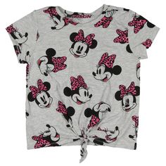 This Disney Minnie Mouse T-Shirt is a delightful blend of style and comfort for young fans. The shirt features an eye-catching all-over print of Minnie Mouse adorned with a chic pink leopard-patterned bow, adding a touch of wild flair to the classic character. The vibrant design captures Minnie’s playful spirit, making it a fun addition to any wardrobe. The tie-front detail at the hem adds a trendy twist, allowing for a customizable fit that’s both stylish and practical. Made from soft, breathab Disney Minnie Mouse Summer Tops, Fun Pink Minnie Mouse Top, Summer Minnie Mouse Short Sleeve T-shirt, Cute Minnie Mouse T-shirt For Summer, Casual Pink Minnie Mouse Top, Playful Minnie Mouse Crew Neck Top, Playful Spring T-shirt With All Over Print, Playful Minnie Mouse Short Sleeve Top, Minnie Mouse Graphic Tee Short Sleeve Top