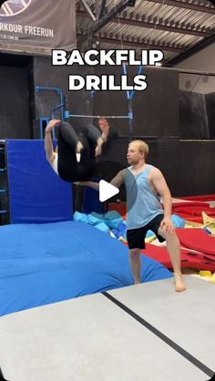 a man standing on top of an inflatable trampoline