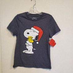 a t - shirt with a cartoon character wearing a santa hat