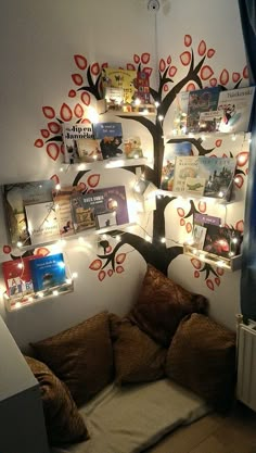 a living room with a tree decorated with pictures and lights