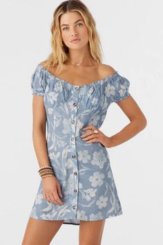 Sweet and essential off-the-shoulder mini that has a button-up design and floral print. O'Neill Women's woven mini dress 25 1/4" In length Off-the-shoulder cap sleeves Front button detail Shirred bust cups Allover print 100% Viscose UPC: 196559466241. Floral Print Off Shoulder Mini Dress For Brunch, Floral Print Off-shoulder Mini Dress For Brunch, Off Shoulder Mini Dress With Floral Print For Brunch, Chic Floral Print Off Shoulder Dress, Summer Off Shoulder Mini Dress, Fitted Floral Print Off Shoulder Dress With Short Sleeves, Fitted Floral Print Off Shoulder Casual Dress, Fitted Casual Off Shoulder Dress With Floral Print, Casual Fitted Off Shoulder Dress With Floral Print