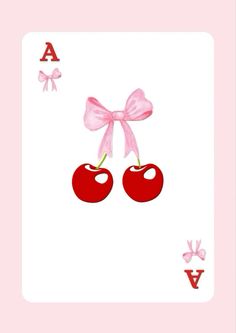 a card with two cherries on it and the letter v in the middle,