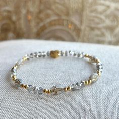 ✨Features 4mm translucent gray faceted rondelle beads, goldfill bead accents, and features gray oval shaped beads with gold image of jesus on cross in bead ✨Dainty , makes perfect for everyday wear or addition to a stack ✨Stretch bracelet makes for easy on and off ✨makes great  gift for religious or spiritual Everyday Gold Crystal Bracelet With Faceted Beads, Gray Beaded Bracelets With Faceted Beads As A Gift, Gray Faceted Beaded Bracelets As Gift, Gray Faceted Beaded Bracelets For Gifts, Gray Faceted Beads Bracelet As Gift, Gray Faceted Beads Bracelet For Gift, Gold Crystal Rondelle Bracelet With Faceted Beads, Neutral Bracelet, Jesus On Cross