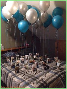 a table with balloons and pictures on it