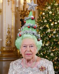 the queen is wearing a christmas tree hat