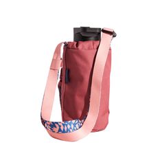 a pink bag with a blue and white design on the front, sitting against a white background