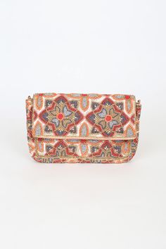 Stash all of your essentials in style with the Lulus Style that Stuns Gold Multi Floral Beaded Clutch! This cute clutch has a variety of sequins and colorful seed beads that create a stunning floral design. A front flap opens from a magnetic closure to reveal a lined interior with a sidewall pocket. The attached gold chain strap allows you to wear this clutch as a crossbody! Lined. Bag measures 10" wide, 6. 5" tall, and 1" deep (relaxed) with a 46" gold chain strap. 100% Cotton. Spot Clean Only. Bohemian Multicolor Embellished Clutch, Traditional Multicolor Beaded Clutch, Multicolor Sequined Bags For Summer, Multicolor Sequined Bag For Summer, Multicolor Sequined Summer Bag, Summer Multicolor Sequined Bag, Sequin Clutch, Beaded Clutch, Magnetic Closure