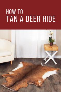 a brown and white animal skin rug in front of a window with the words how to tan a deer hide on it