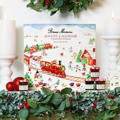 a christmas mantle with candles, wreaths and an advertise calendar on it