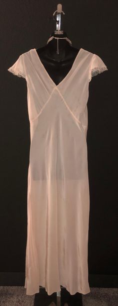 "Ultra gorgeous pink nightgown, made of rayon, has a dainty eyelet and satin stitching around the collar and arms. Made by Slender Style, bust will fit 42\", waist 36\", hips 46\", length is 56\" - lovely condition!" Cheap Pink Romantic Nightgown, Pink Fitted Chemise For Wedding Night, Fitted Pink Chemise For Wedding Night, Vintage Pink Slip Dress For Daywear, Vintage Fitted Nightgown, Pink Bias Cut Slip Dress, 50s Nightgown, Dramatic Romantic, Pink Nightgown