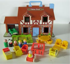 there is a toy fire station with toys around it