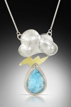 Gold, Silver & Stone Necklace - The center of this sterling silver necklace consists of a sterling silver cloud with roller printed textures and die-formed shaping. The top piece is hollow-formed, while the center piece is a sterling silver and 18k bimetal lightning bolt with roller printed textures. A pear-shaped piece of blue larimar hangs from the lightning bolt, bezel-set in sterling silver. Sterling silver wheat chain with a lobster clasp closure. Hollow Form, Silver Cloud, The Lightning, Artful Home, Lightning Bolt, Sterling Silver Necklace, Bezel Setting, Stone Necklace, Pear Shaped