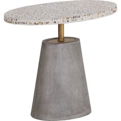 a round table with a gold base and dots on the top, sitting in front of a white background